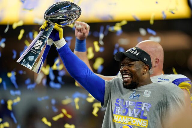 Los Angeles Rams outside linebacker Von Miller (40) raises the Vince Lombardi Trophy after Super Bowl 56 between the Cincinnati Bengals and the Los Angeles Rams at SoFi Stadium in Inglewood, Calif., on Sunday, Feb. 13, 2022. The Rams came back in the final minutes of the game to win 23-20 on their home field.