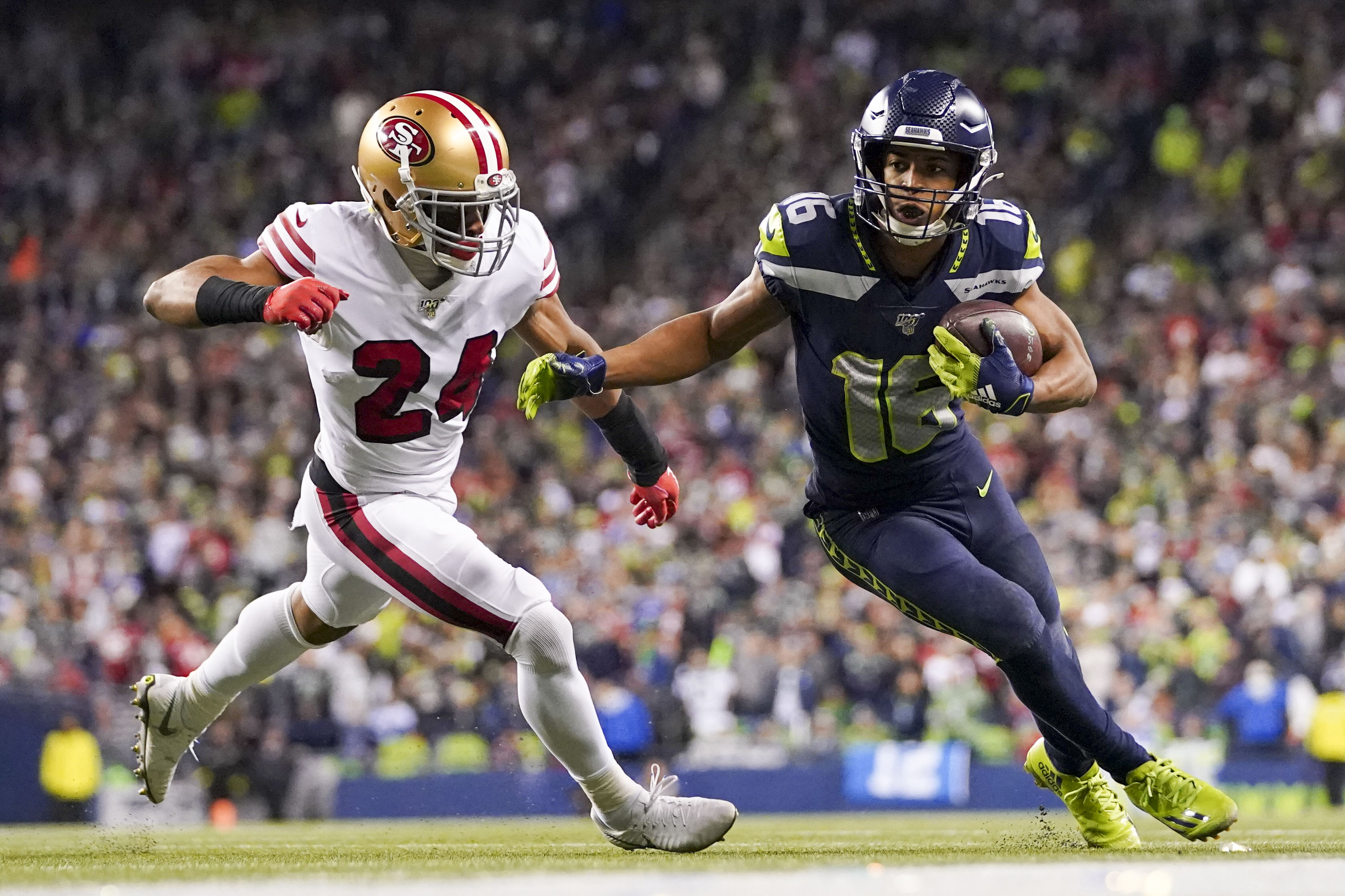 Seattle Seahawks wide receiver Tyler Lockett (16) is tackled by San Francisco 49ers defensive back K'Waun Williams (24) during the fourth quarter at CenturyLink Field.