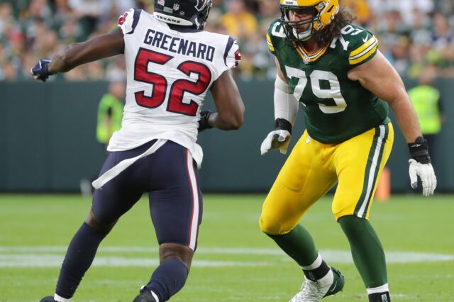 Green Bay Packers tackle Dennis Kelly (79) provides pass protection from Houston Texans defensive end Jonathan Greenard (52) during their preseason game Saturday, August 14, 2021 at Lambeau Field in Green Bay, Wis. The Houston Texans beat the Green Bay Packers 26-7