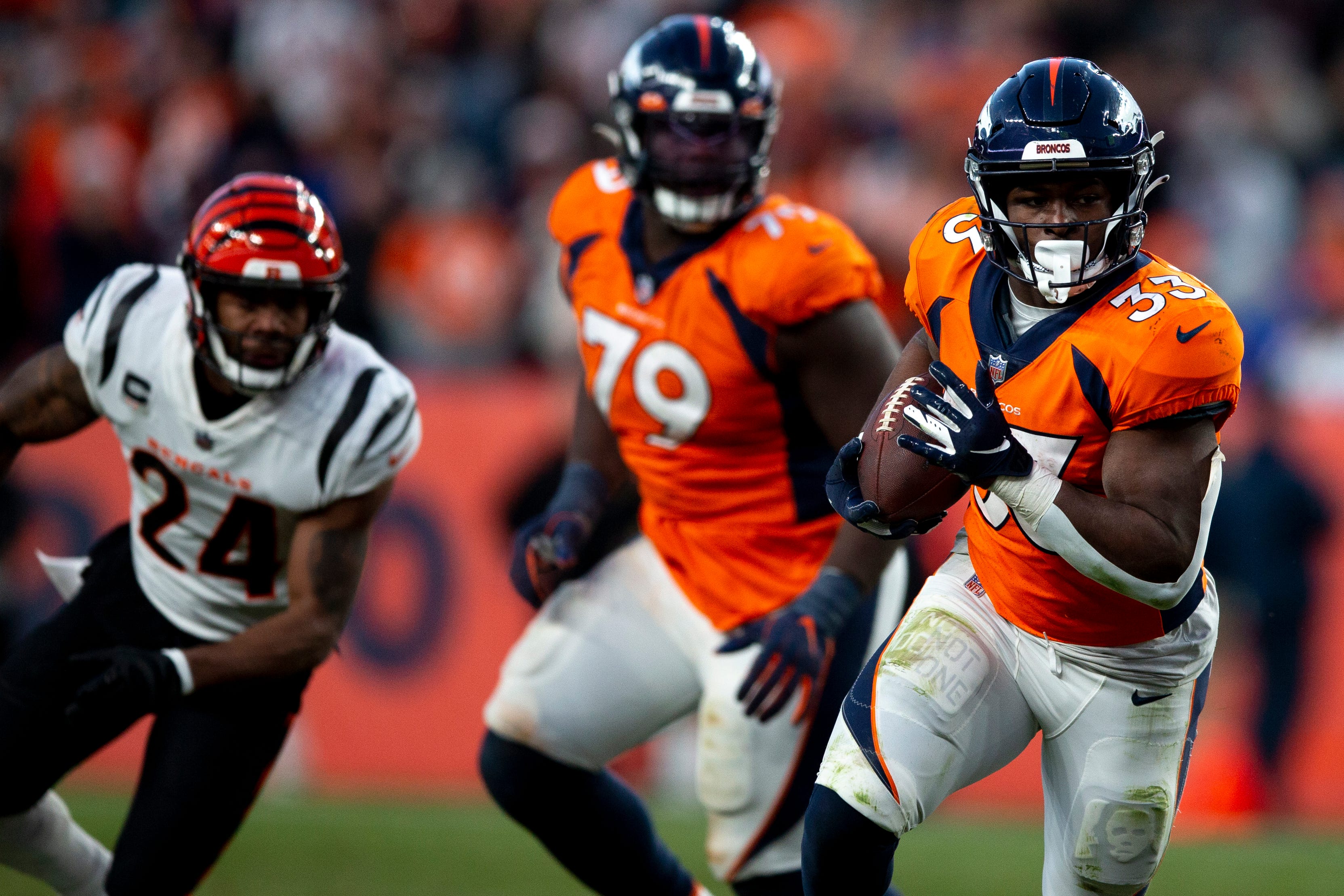 Denver Broncos running back Javonte Williams (33) runs downfield in the second half of the NFL football game on Sunday, Dec. 19, 2021, at Empower Field in Denver. Cincinnati defeated the Broncos 15-10.