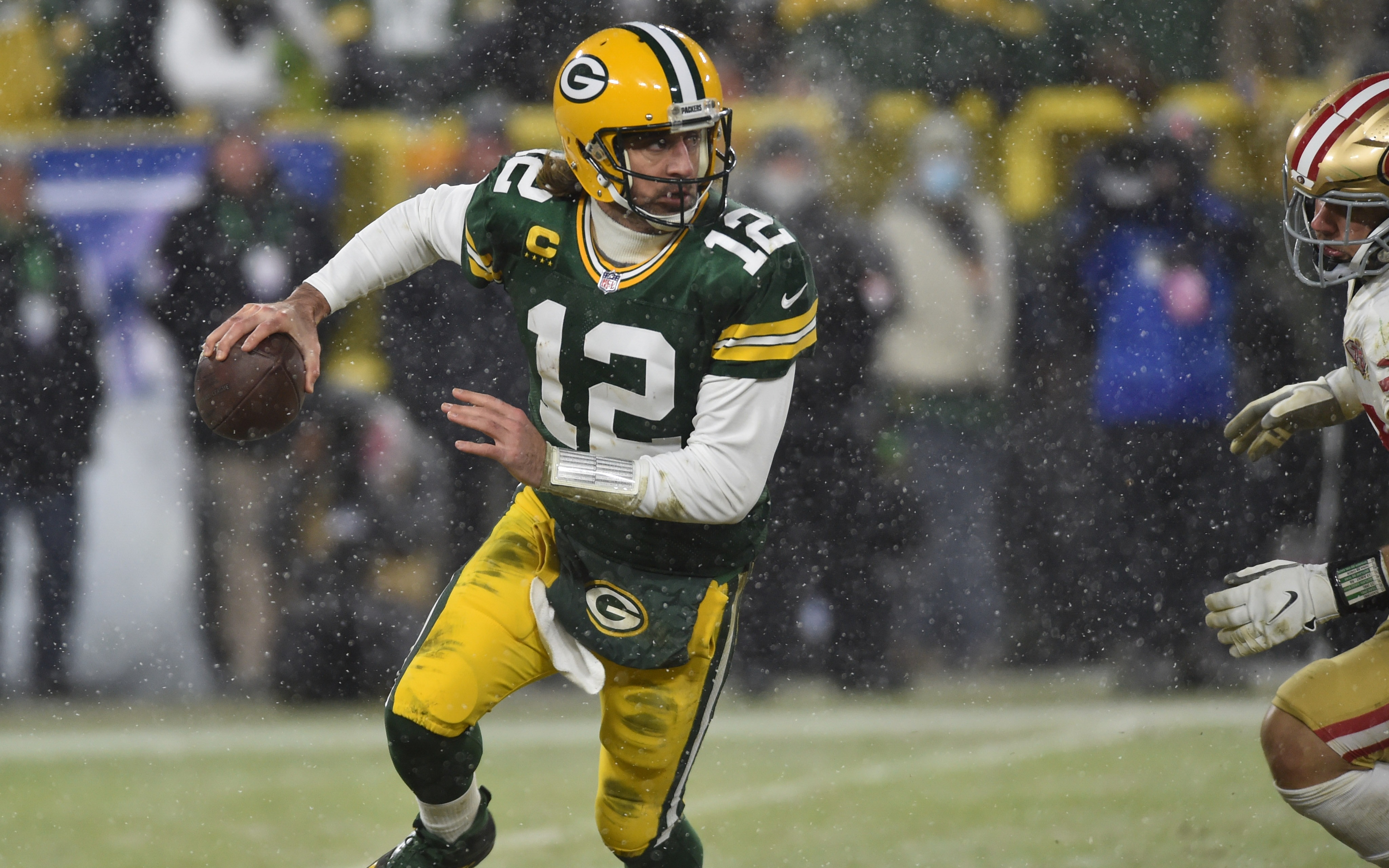 Rodgers rolls out. Credit: Jeffrey Baker, USA TODAY Sports.
