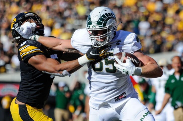 Colorado State Rams tight end Trey McBride (85) runs with the ball after a catch as Iowa Hawkeyes linebacker Jestin Jacobs (5) goes to make the tackle during the second quarter at Kinnick Stadium.