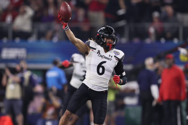 Cincinnati Bearcats safety Bryan Cook (6) celebrates an interception in the third quarter against the Alabama Crimson Tide during the 2021 Cotton Bowl college football CFP national semifinal game at AT&T Stadium.