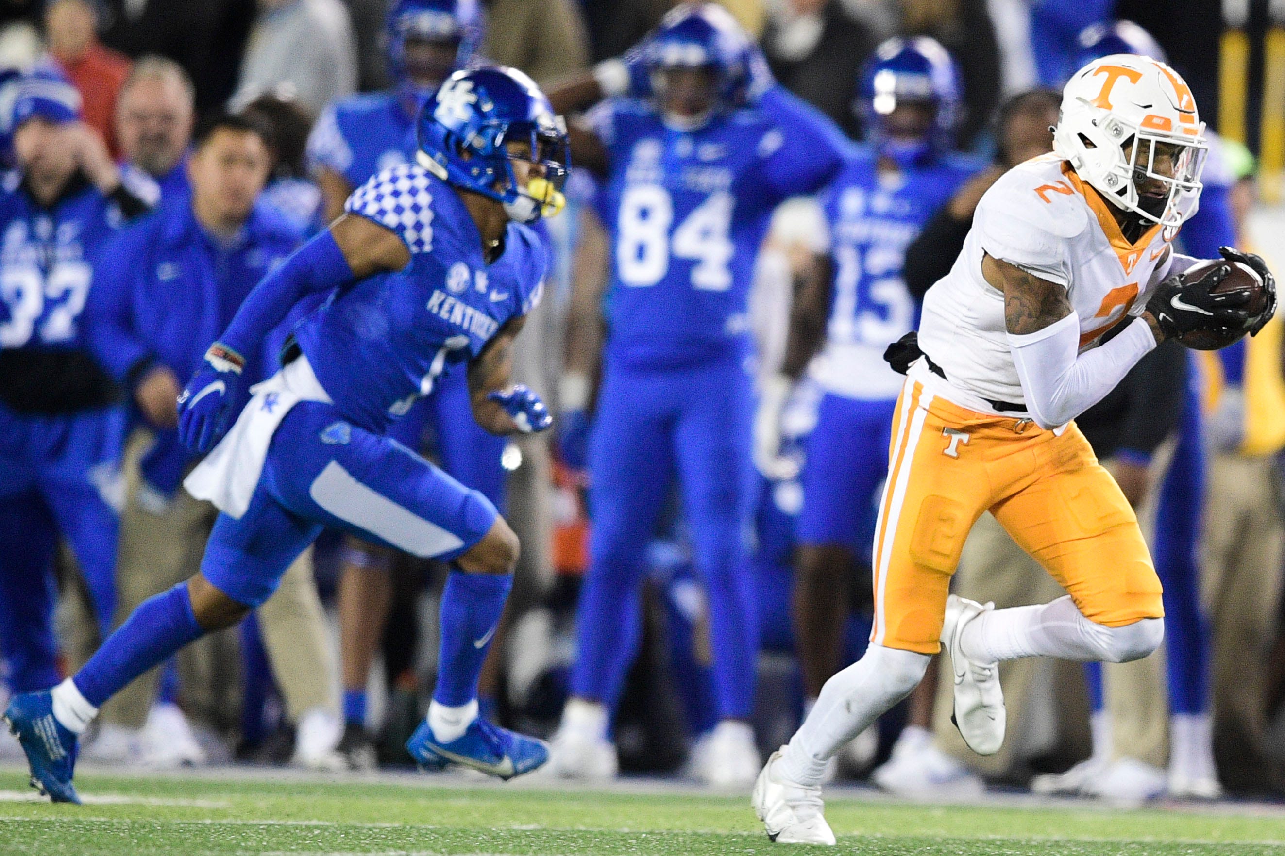 Tennessee defensive back Alontae Taylor (2) intercepts a pass intended for Kentucky wide receiver Wan'Dale Robinson (1) and runs the ball for a touchdown during an SEC football game between Tennessee and Kentucky at Kroger Field in Lexington, Ky. on Saturday, Nov. 6, 2021.  Kns Tennessee Kentucky Football