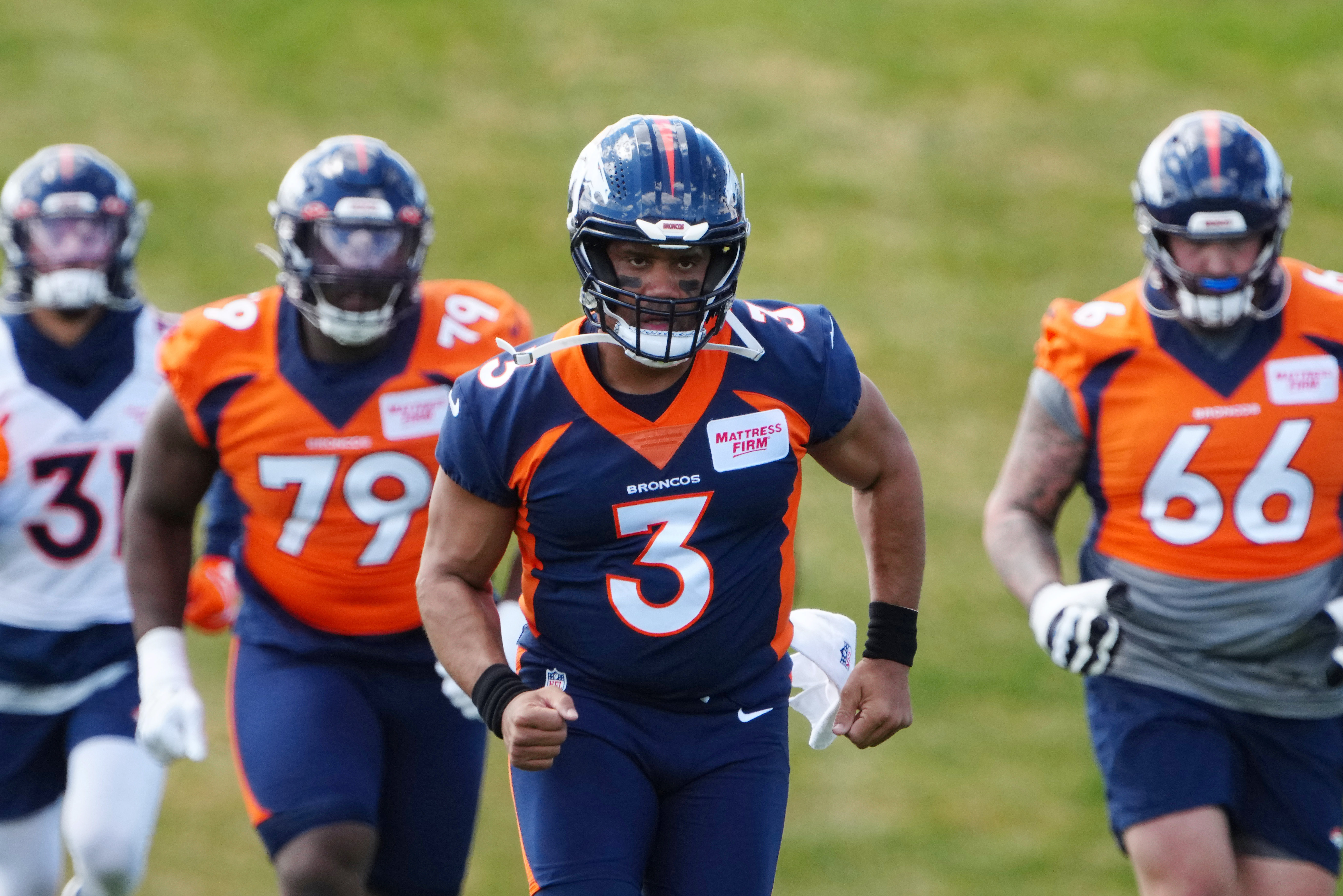 Denver Broncos quarterback Russell Wilson (3) runs during a Denver Broncos mini camp at UCHealth Training Center.