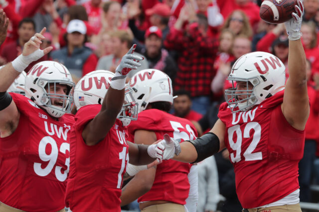 Wisconsin defensive end Matt Henningsen (92) celebrates his fumble recovery for a touchdown during the fourth quarter of their game against Northwestern at Camp Randall Stadium.