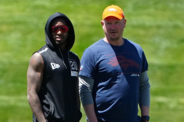 Nathaniel Hackett and KJ Hamler watch rookie minicamp on Friday. Credit: Ron Chenoy, USA TODAY Sports.