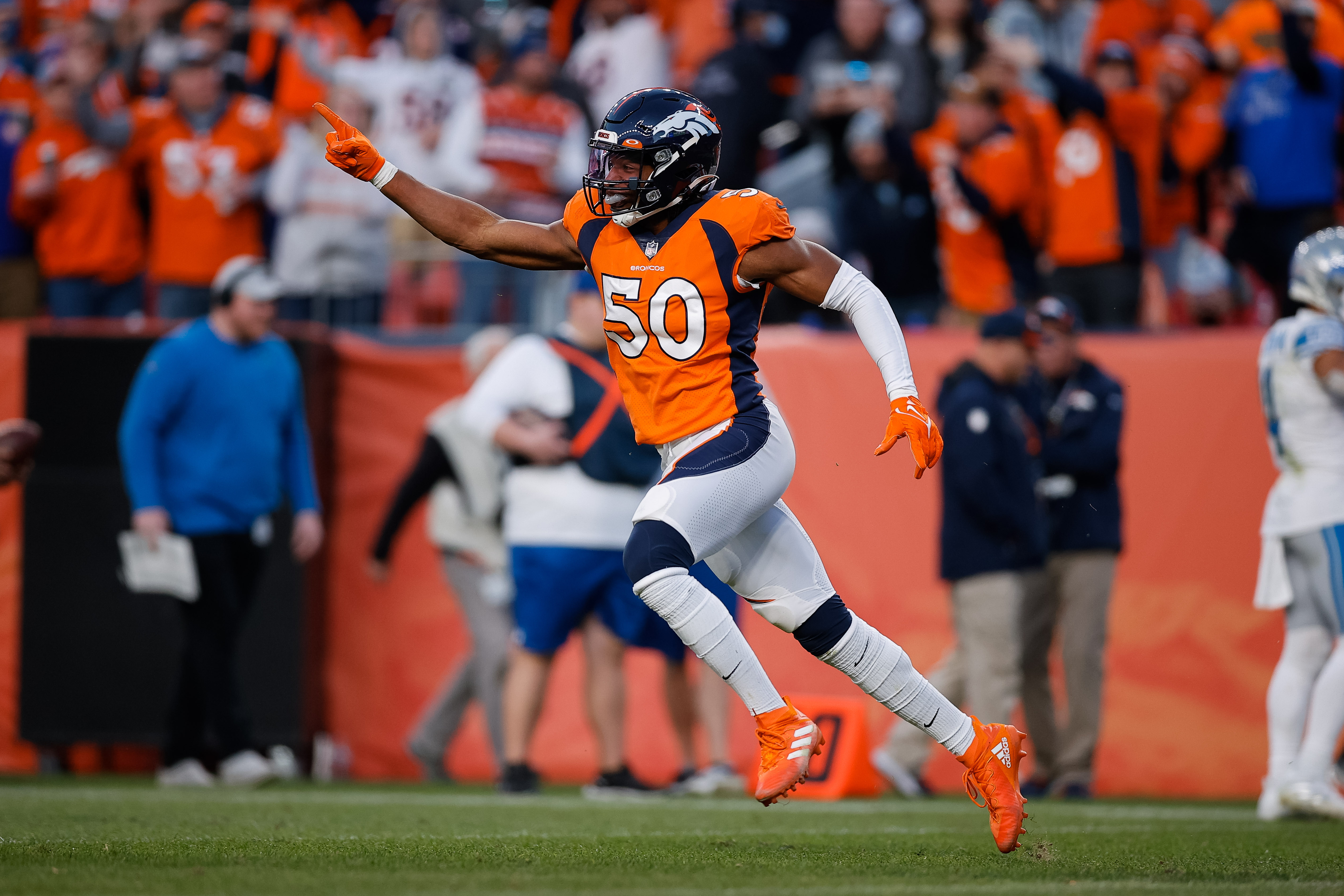 Denver Broncos linebacker Jonas Griffith (50) celebrates after a play in the fourth quarter against the Detroit Lions at Empower Field at Mile High.