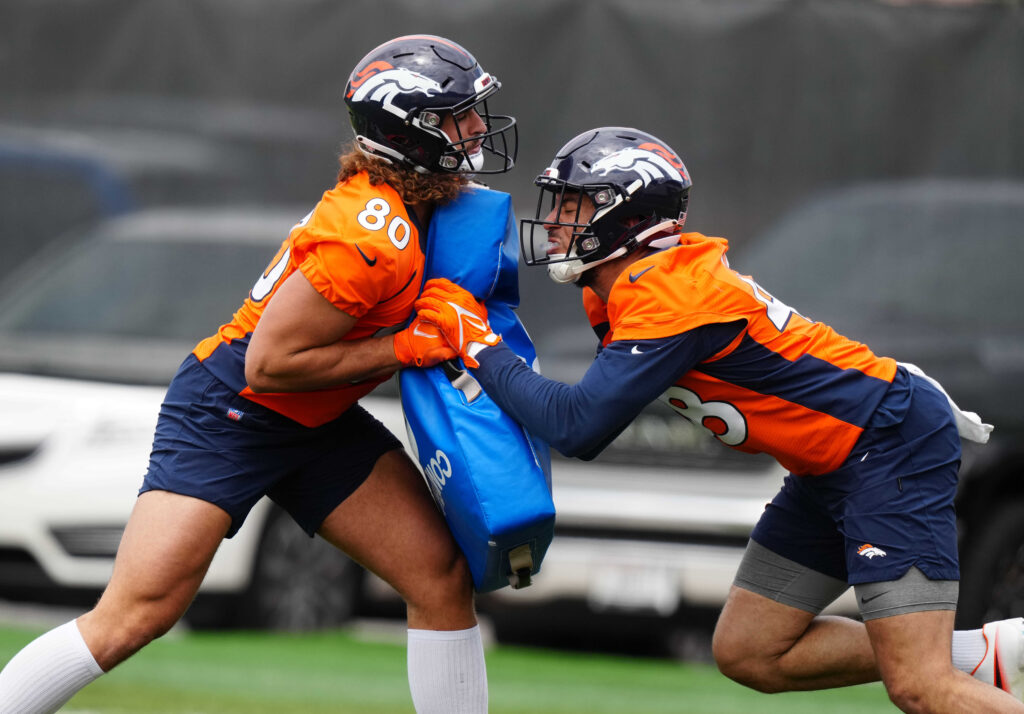 Denver Broncos tight end Greg Dulcich (80) and wide receiver Trey Quinn (84) during OTA workouts at the UC Health Training Center. 