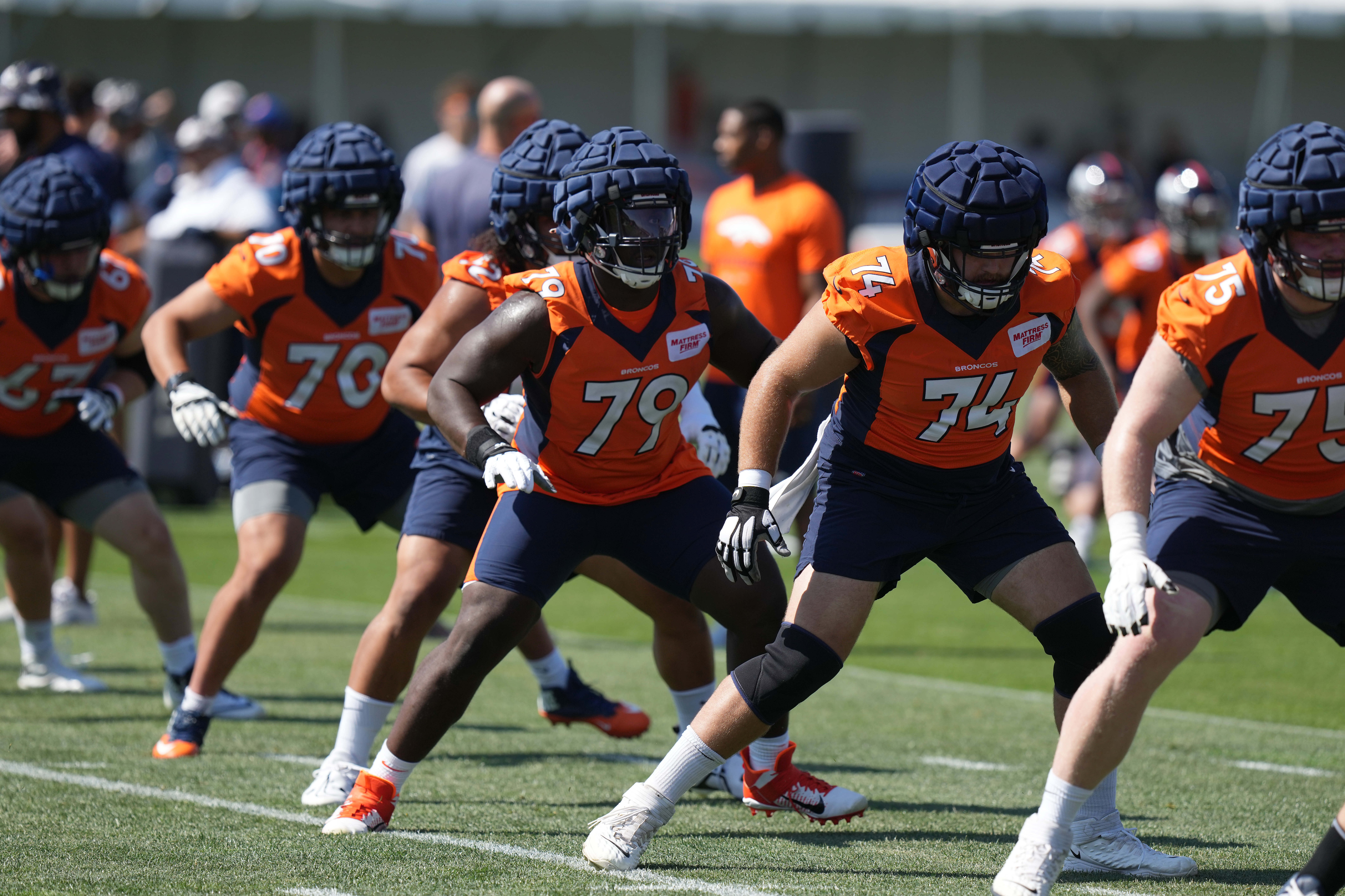 Denver Broncos center Lloyd Cushenberry III (79) and tackle Casey Tucker (74) during training camp at the UCHealth Training Center.