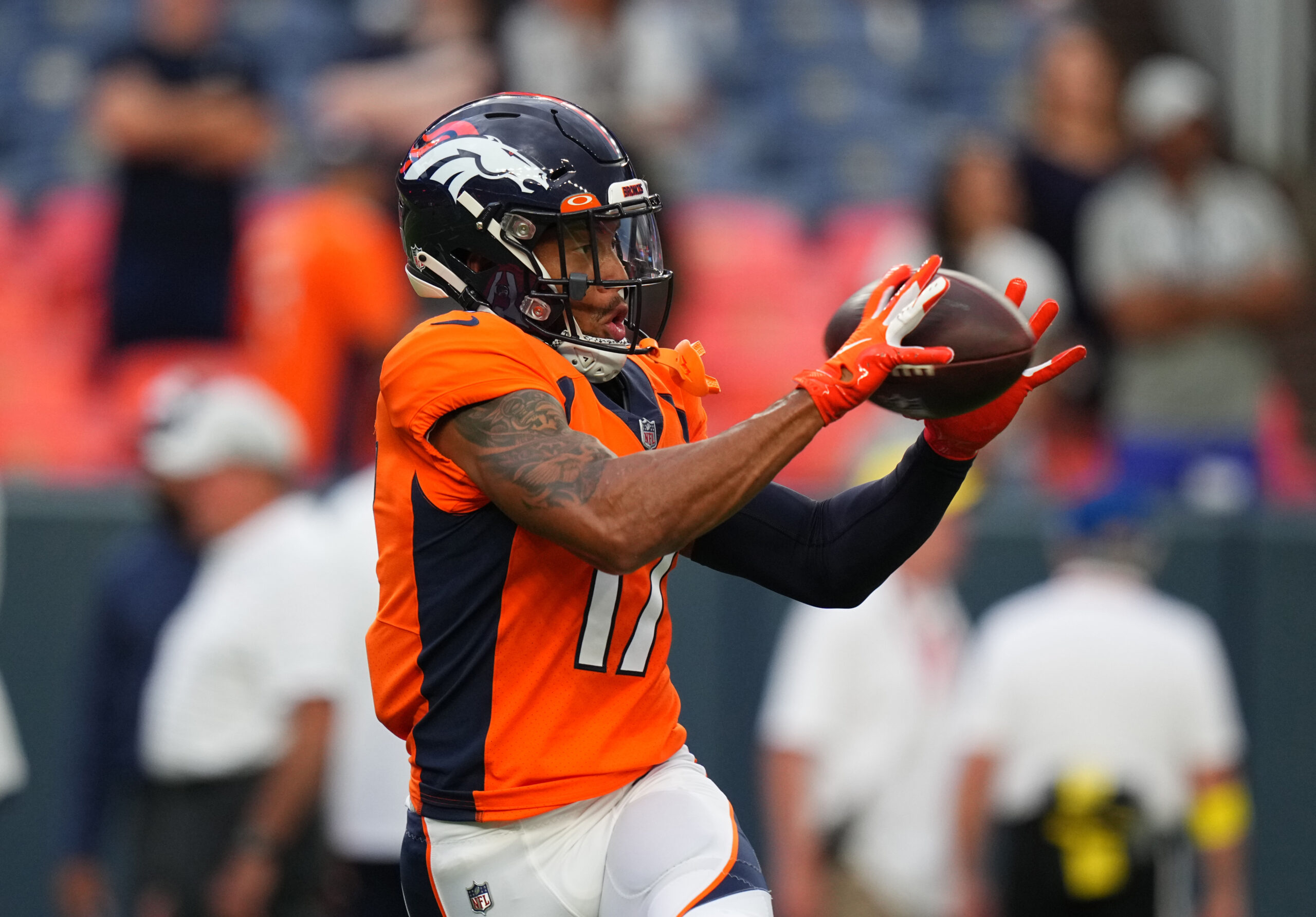 Denver Broncos wide receiver Jalen Virgil (15) warms up before an