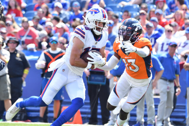 Buffalo Bills wide receiver Jake Kumerow (15) turns upfield after a catch as Denver Broncos cornerback Michael Ojemudia (13) looks to make a tackle in the second quarter of a pre-season game at Highmark Stadium. Mandatory Credit: Mark Konezny-USA TODAY Sports