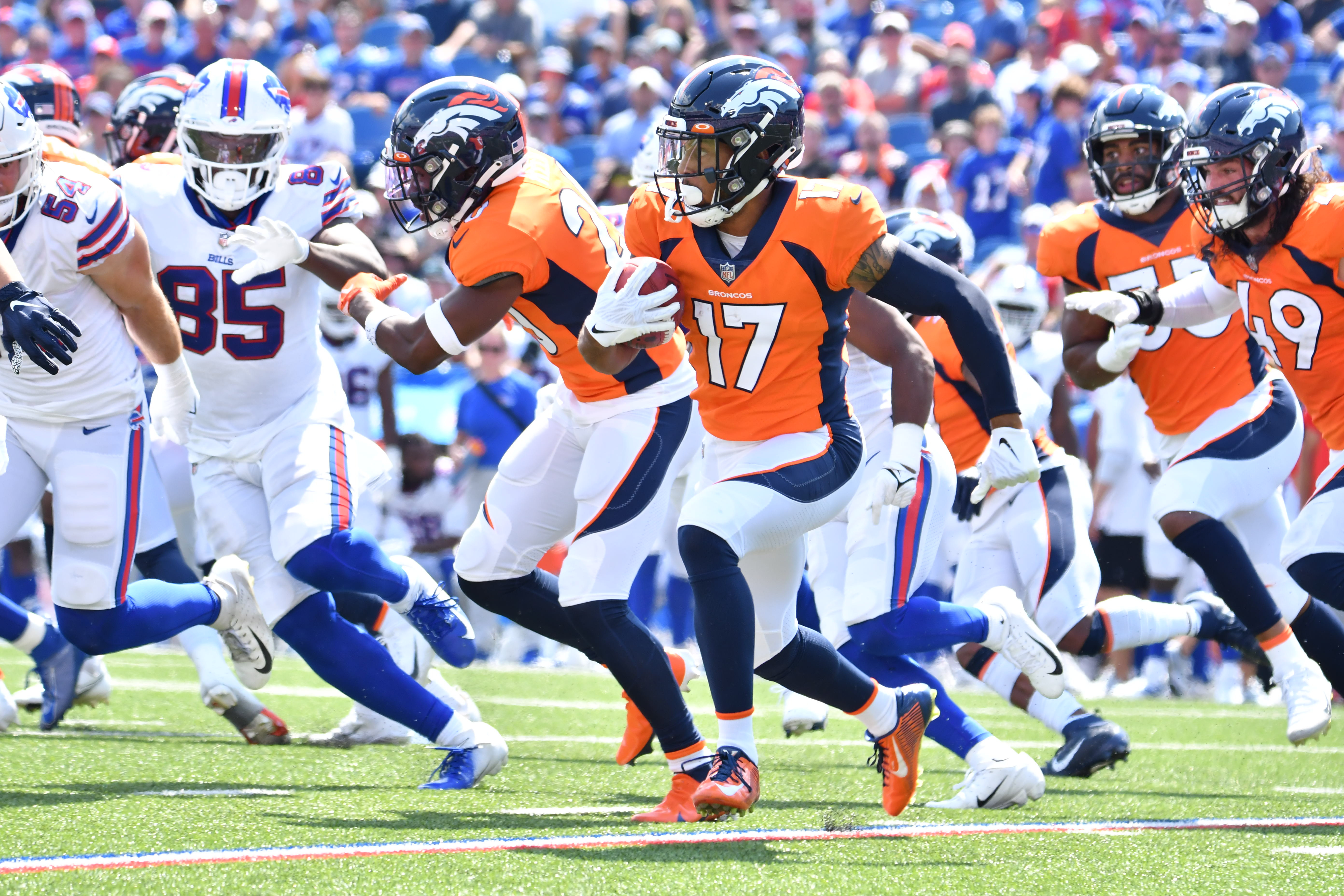 Denver Broncos punter Corliss Waitman (17) returns a kickoff in the second quarter of a pre-season game against the Buffalo Bills at Highmark Stadium.