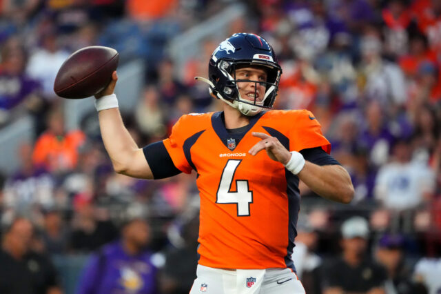 Denver Broncos quarterback Brett Rypien (4) prepares to pass the ball the ball in the first quarter against the Minnesota Vikings at Empower Field at Mile High.