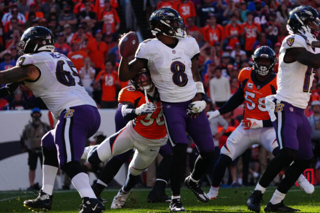 Denver Broncos safety Caden Sterns (30) sacks Baltimore Ravens quarterback Lamar Jackson (8) in the third quarter at Empower Field at Mile High.