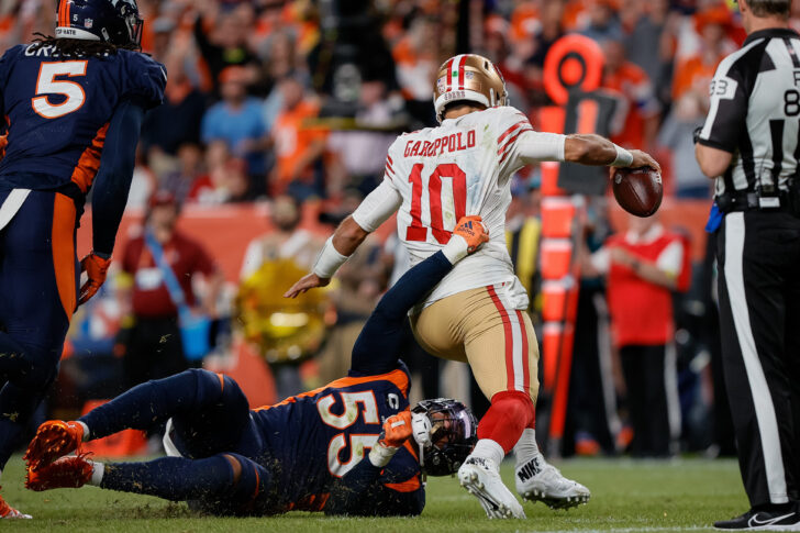 San Francisco 49ers quarterback Jimmy Garoppolo (10) is sacked by Denver Broncos linebacker Bradley Chubb (55) in the fourth quarter at Empower Field at Mile High.