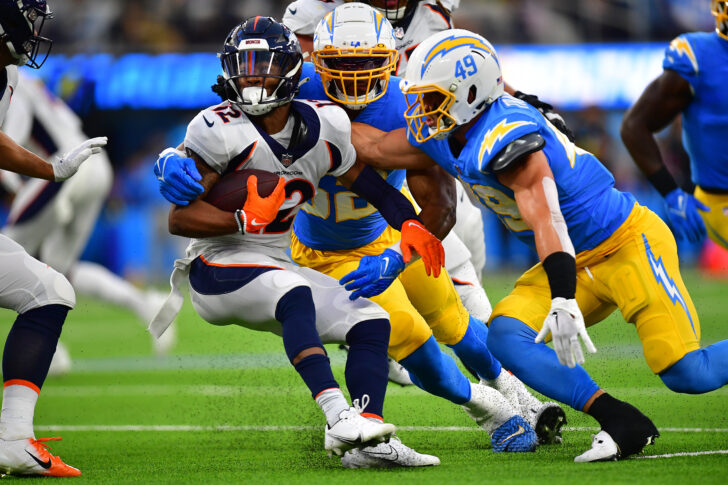 Denver Broncos wide receiver Montrell Washington (12) is brought down by Los Angeles Chargers linebacker Drue Tranquill (49) and linebacker Khalil Mack (52) during the first half at SoFi Stadium. (Coach Rosburg)