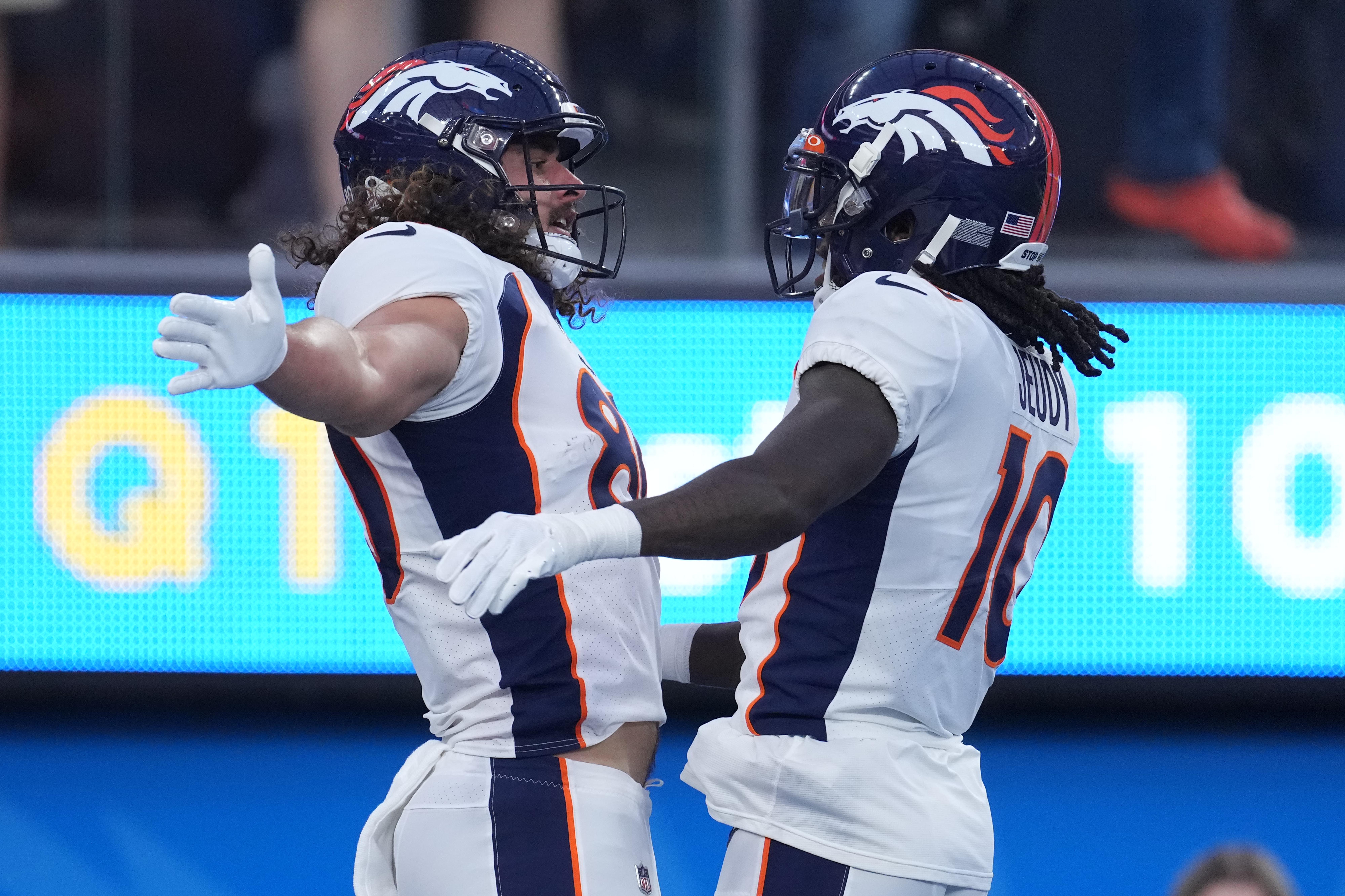 Denver Broncos tight end Greg Dulcich (80) and wide receiver Jerry Jeudy (10) celebrate after a touchdown against the Los Angeles Chargers in the first half at SoFi Stadium.