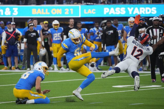 Los Angeles Chargers place kicker Dustin Hopkins (6) kicks a 39-yard fielg goal out of the hold of punter JK Scott (16) in overtime against the Denver Broncos in AFC West battle at SoFi Stadium.