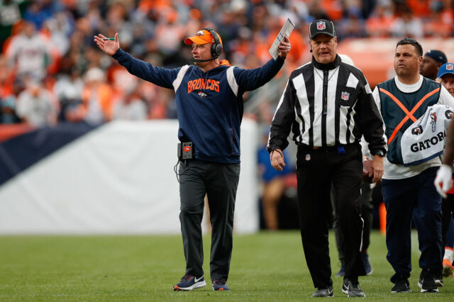 Denver Broncos head coach Nathaniel Hackett reacts after a play as down judge Jerry Bergman (91) looks on in the fourth quarter against the New York Jets at Empower Field at Mile High.