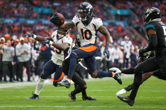Denver Broncos wide receiver Jerry Jeudy (10) leaps into the end zone for a touchdown against the Jacksonville Jaguars in the second quarter during an NFL International Series game at Wembley Stadium.