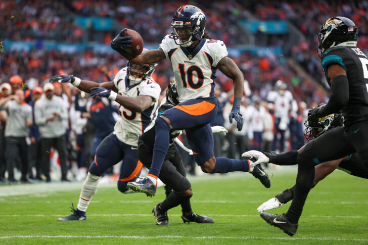 Denver Broncos wide receiver Jerry Jeudy (10) leaps into the end zone for a touchdown against the Jacksonville Jaguars in the second quarter during an NFL International Series game at Wembley Stadium.