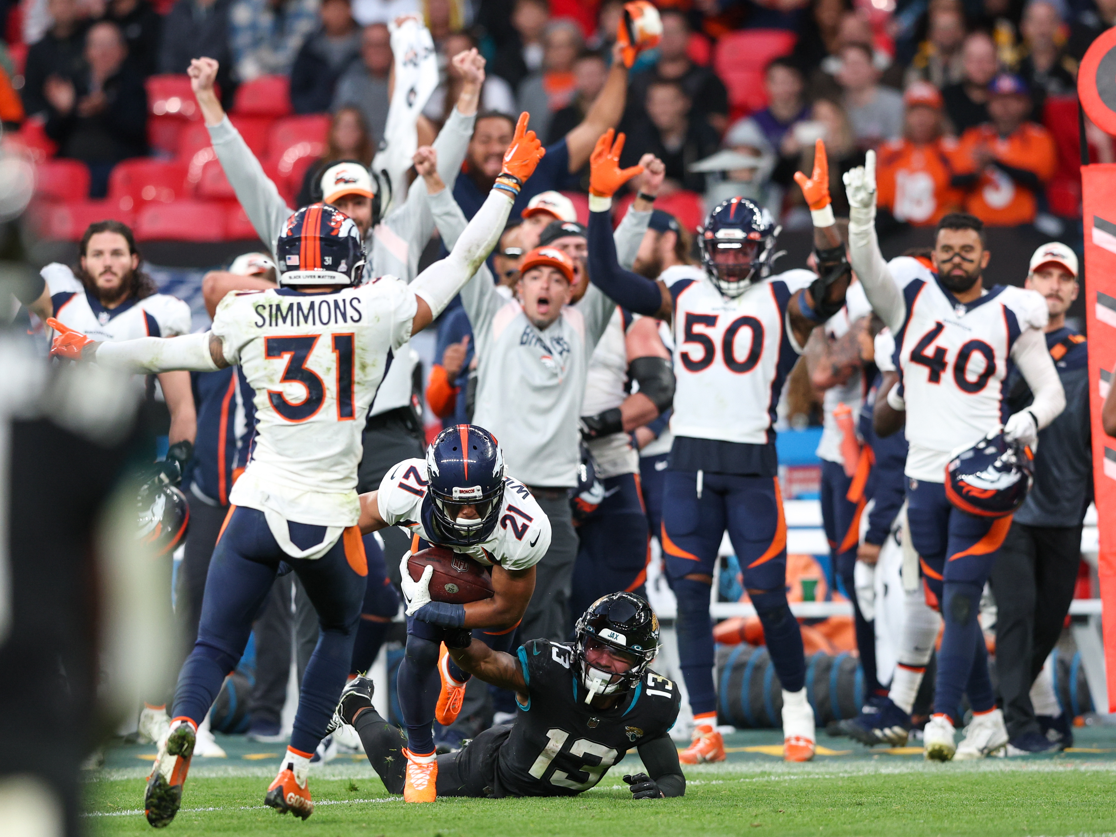 Denver Broncos cornerback KWaun Williams (21) intercepted the ball from Jacksonville Jaguars quarterback Trevor Lawrence (16) (not pictured) in the fourth quarter during an NFL International Series game at Wembley Stadium. 