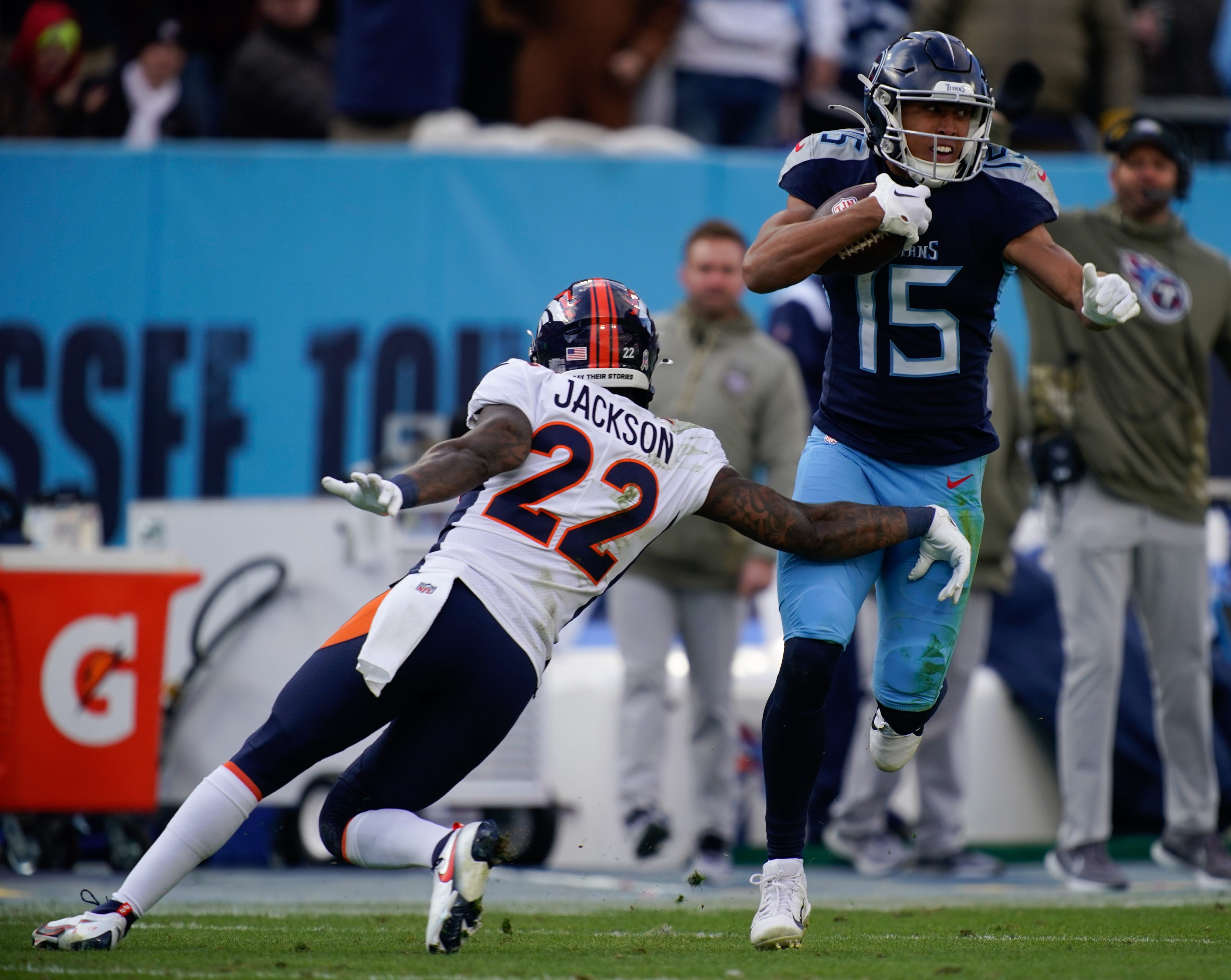 Tennessee Titans wide receiver Nick Westbrook-Ikhine (15) gets away from Denver Broncos safety Kareem Jackson (22) as he runs in a touch down during the third quarter at Nissan Stadium Sunday, Nov. 13, 2022, in Nashville, Tenn.