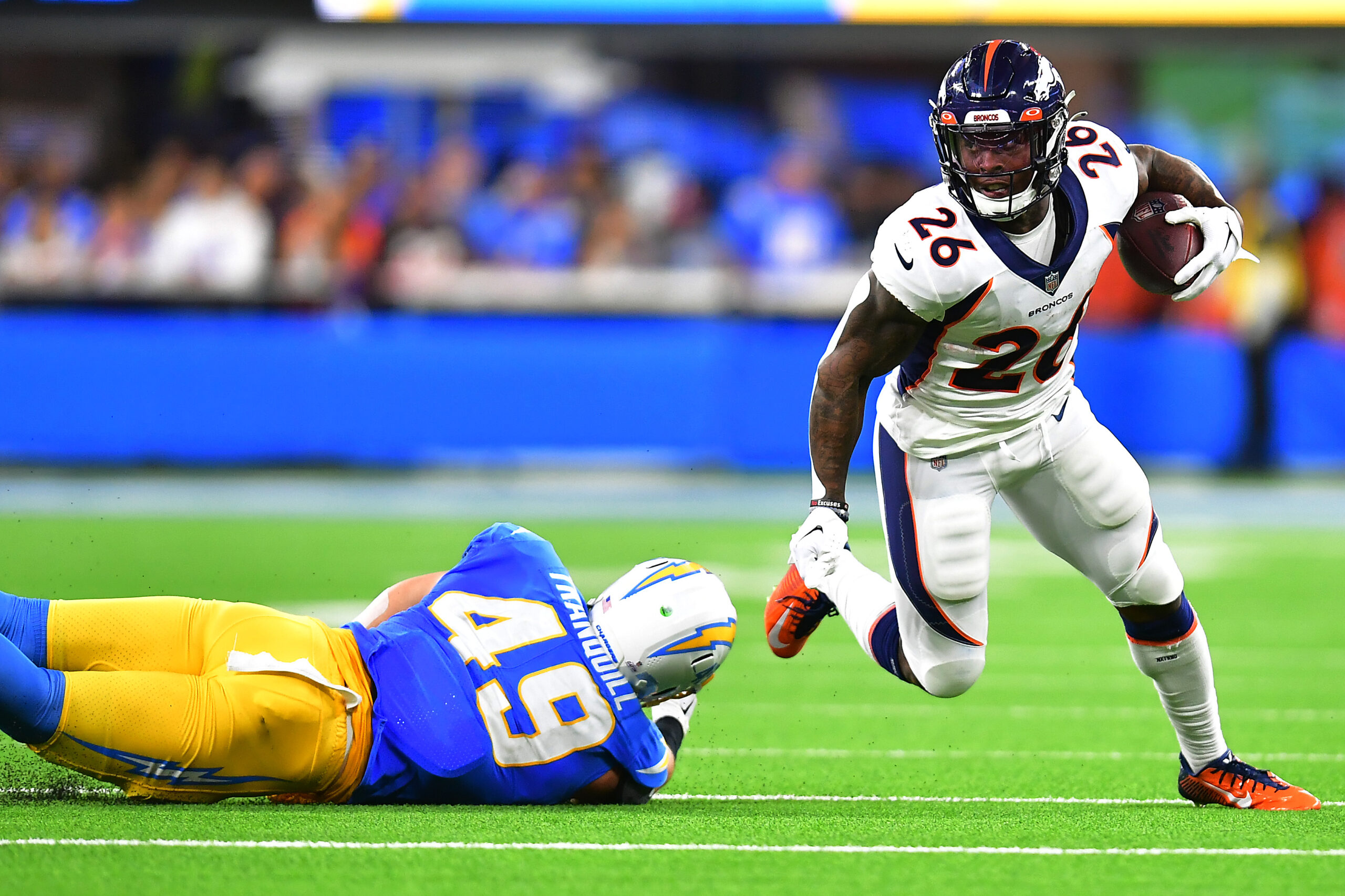 Denver Broncos running back Mike Boone looks to his teammates