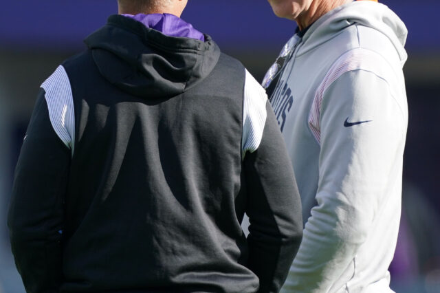 Baltimore Ravens head coach John Harbaugh (left) talks with Denver Broncos coach Jerry Rosburg (right) prior to the game at M&T Bank Stadium.