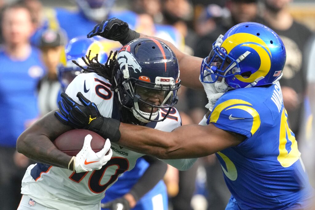 Denver Broncos wide receiver Jerry Jeudy (10) carries the ball against Los Angeles Rams linebacker Bobby Wagner (45) in the first half at SoFi Stadium.