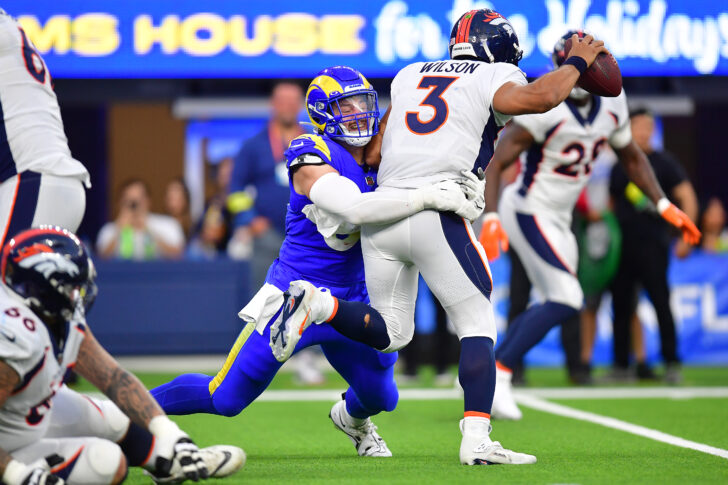 Denver Broncos quarterback Russell Wilson (3) is sacked by Los Angeles Rams defensive tackle Michael Hoecht (97) during the second half at SoFi Stadium.