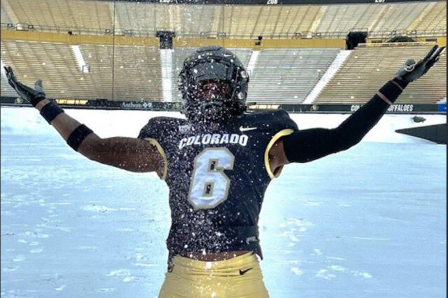 Colorado Buffaloes Recruit Boo Carter plays in the snow at Folsom Field in Boulder, Colorado.