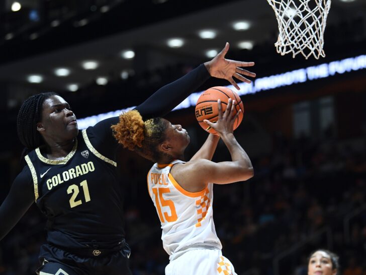 Tennessee guard Jasmine Powell (15) shots and scores scores while guarded by Colorado center Aaronette Vonleh (21) during the NCAA college basketball game between the Tennessee Lady Vols and Colorado Buffaloes on Friday, November 25, 2022 in Knoxville Tenn.