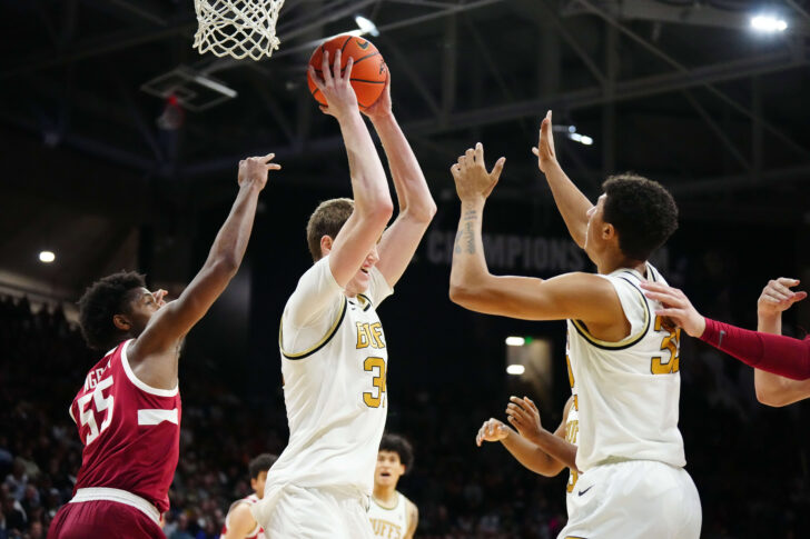 Feb 5, 2023; Boulder, Colorado, USA; Colorado Buffaloes center Lawson Lovering (34) pulls in a rebound away from Stanford Cardinal forward Harrison Ingram (55) in the second half at the CU Events Center. 