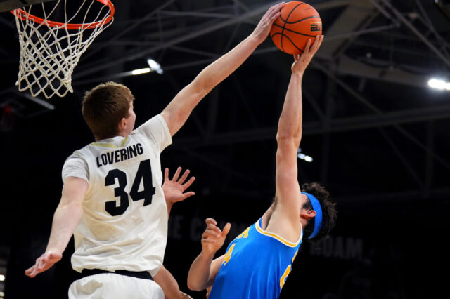 Colorado Buffaloes center Lawson Lovering (34) blocks UCLA Bruins guard Jaime Jaquez Jr. (24) in the second half at th