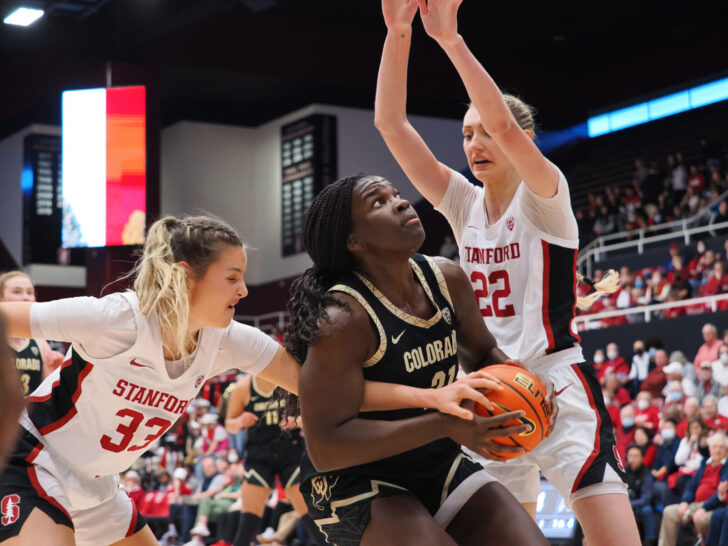 Stanford Cardinal guard Hannah Jump (33) and Stanford Cardinal forward Cameron Brink (22) defend Colorado Buffaloes center Aaronette Vonleh (21) during the first quarter at Maples Pavilion.