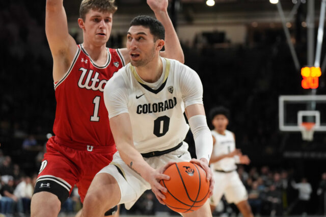 Utah Utes forward Ben Carlson (1) defends on Colorado Buffaloes guard Luke O'Brien (0) on the first half at the CU Events Center.