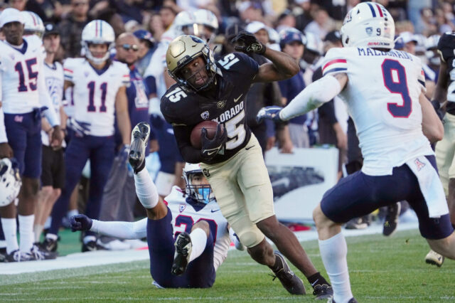 Colorado Buffaloes (CU Buffs) wide receiver Montana Lemonious-Craig (15) carries the ball against the Arizona Wildcats in the fourth quarter at Folsom Field.