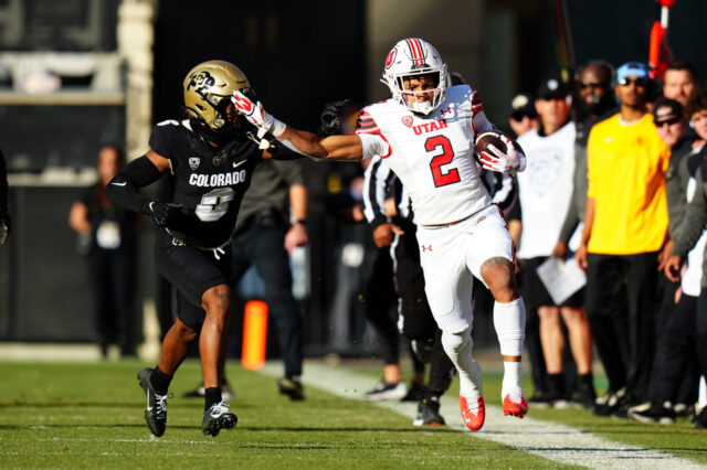Colorado Buffaloes cornerback Nikko Reed (6) pushes Utah Utes running back Micah Bernard (2) out of bounds in the first quarter at Folsom Field.