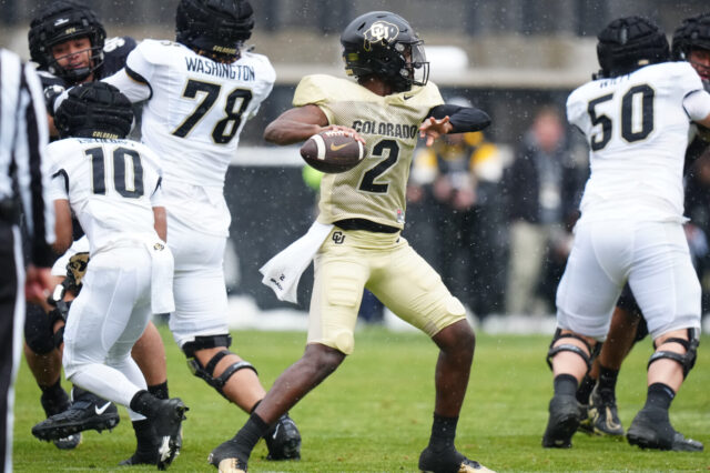 Colorado Buffaloes quarterback Shedeur Sanders (12) prepares to pass during the first half of the spring game at Folsom Field.