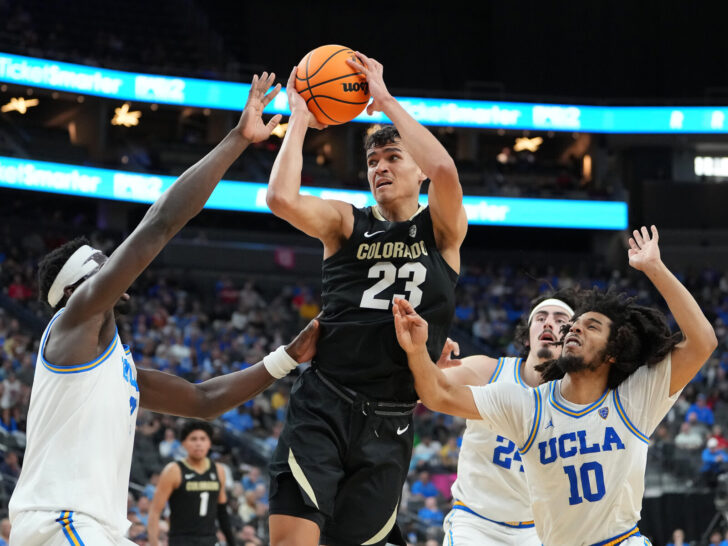 Colorado Buffaloes forward Tristan da Silva (23) looks to shoot between UCLA Bruins forward Adem Bona (3) and guard Tyger Campbell (10) during the second half at T-Mobile Arena.