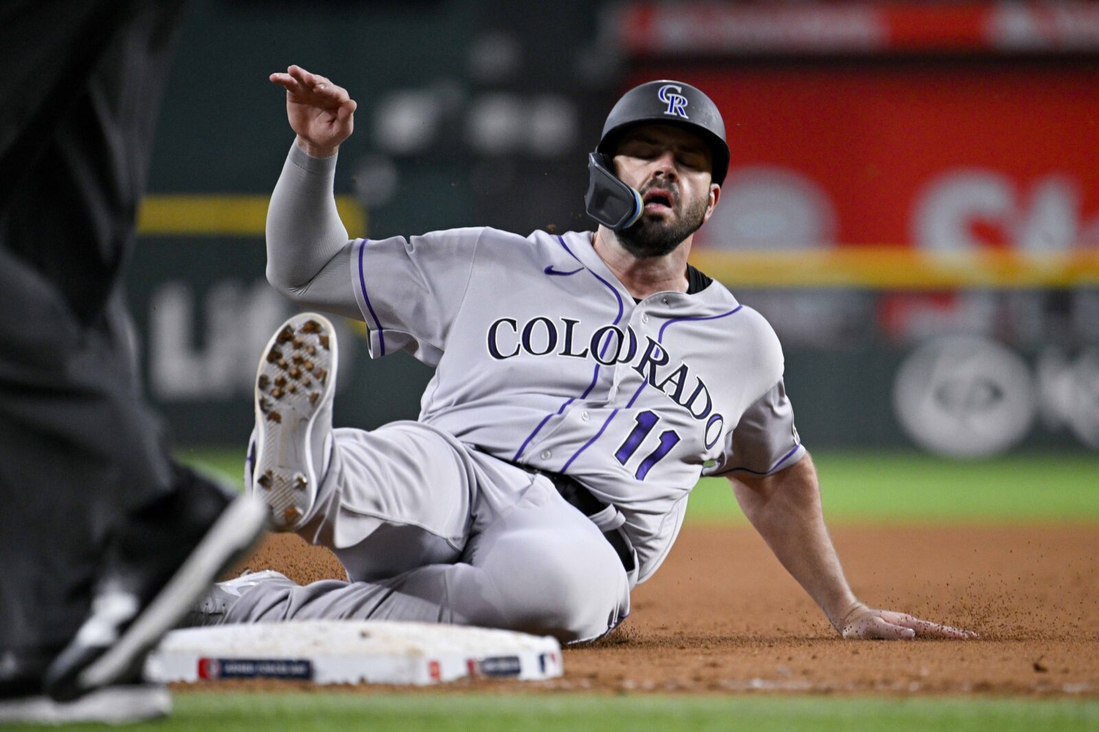 Colorado Rockies first baseman Mike Moustakas scores on an RBI