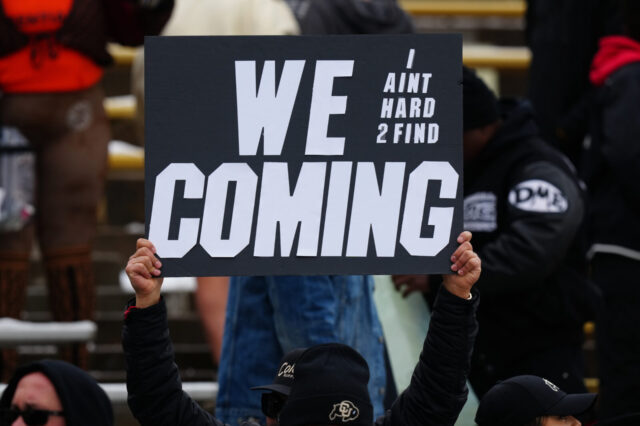 Colorado Buffaloes fan holds a sign before the start of the spring football game during at Folsom Filed.