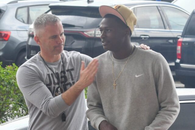Florida State head football coach Mike Norvell (right) greets 5-star CU Buffs target Charles Lester on Friday, March 10, 2023.