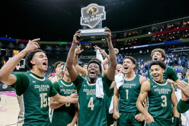 Isaiah Stevens and CSU lift trophy on Thanksgiving Day.