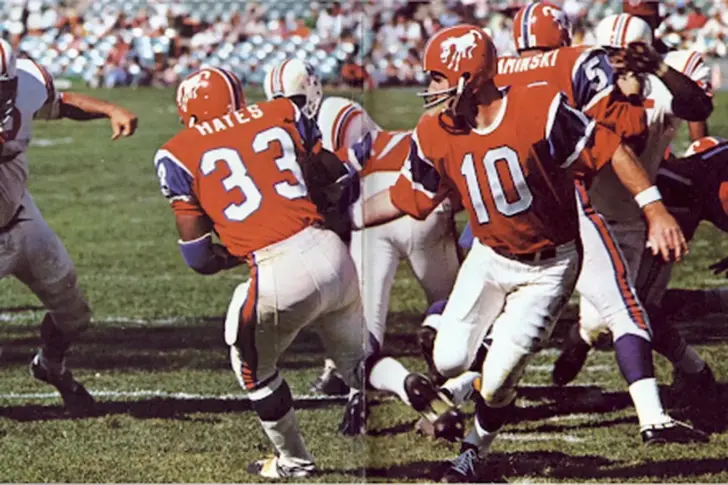 1965 Broncos jerseys with crazy horse, orange helmet and blue shoulders and sleeves.