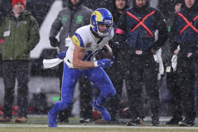 Cooper Kupp runs in the snow.