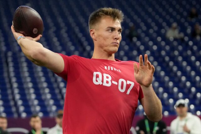 Bo Nix in a red shirt at the 2024 NFL Combine. He's throwing a pass.