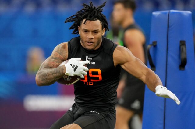 Omarion Hampton runs at the NFL Combine.